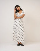 cream dress with polka dots