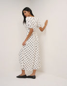 cream dress with polka dots