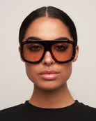 oversized aviator sunglasses with tortoise frame and pink lenses 