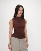 mock neck sleeveless top in brown with synching at the waist