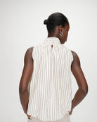 sleeveless top with bubble bottom and a tie at the neck in cream