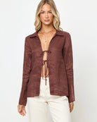 brown front tie long sleeve top with a collar