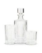 a glass decanter with a glass stopper and two different sized matching glasses