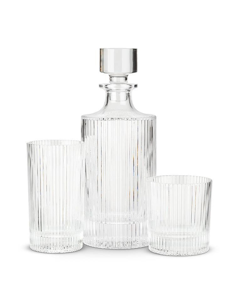 a glass decanter with a glass stopper and two different sized matching glasses