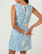 mini dress with high neck and blue and cream swirl pattern