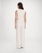 beige vest with a tie around the waist