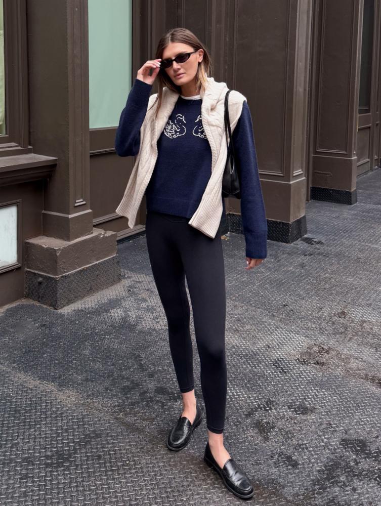 navy cashmere sweater with a white swan on the front