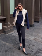 navy cashmere sweater with a white swan on the front
