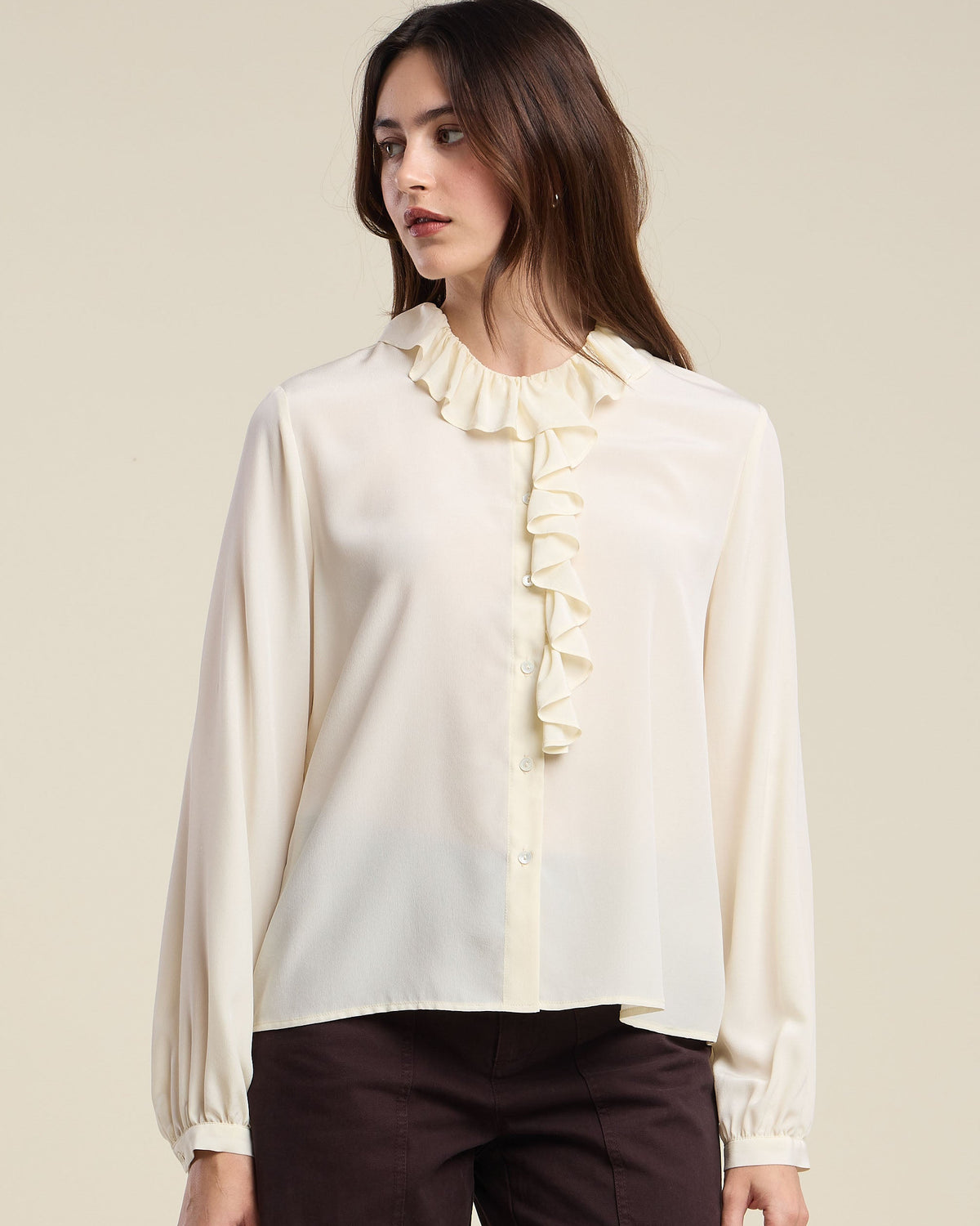 cream blouse with a ruffle collar
