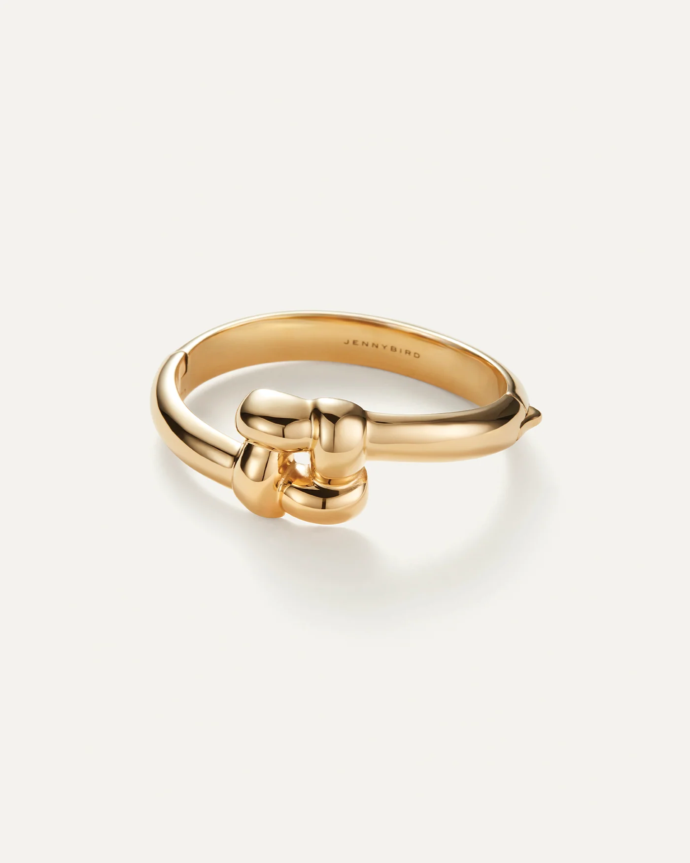 statement gold bangle with woven design