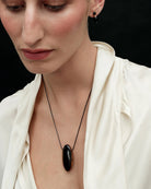 cord necklace with brown oval pendant stone