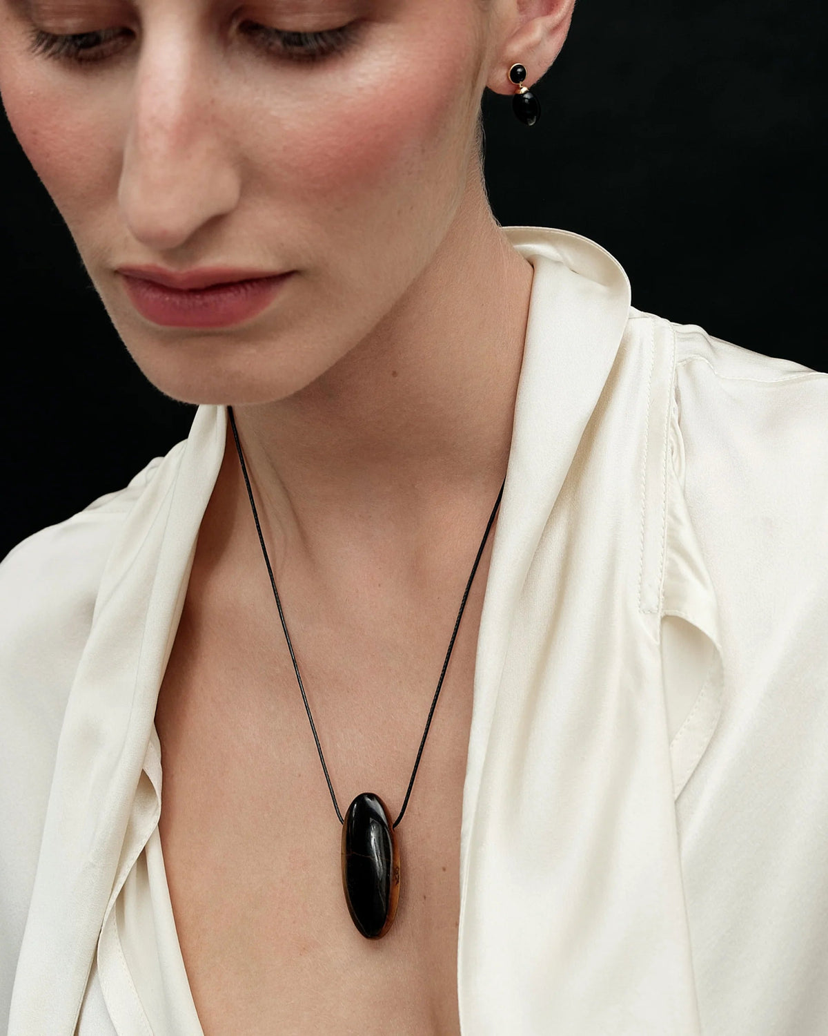 cord necklace with brown oval pendant stone