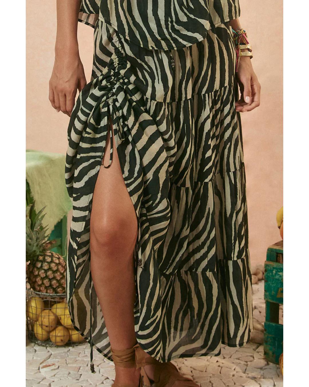 Person wearing a zebra print skirt with a slit up the side