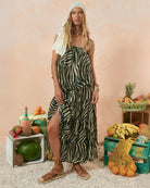 Woman in a zebra print dress in charcoal and cream